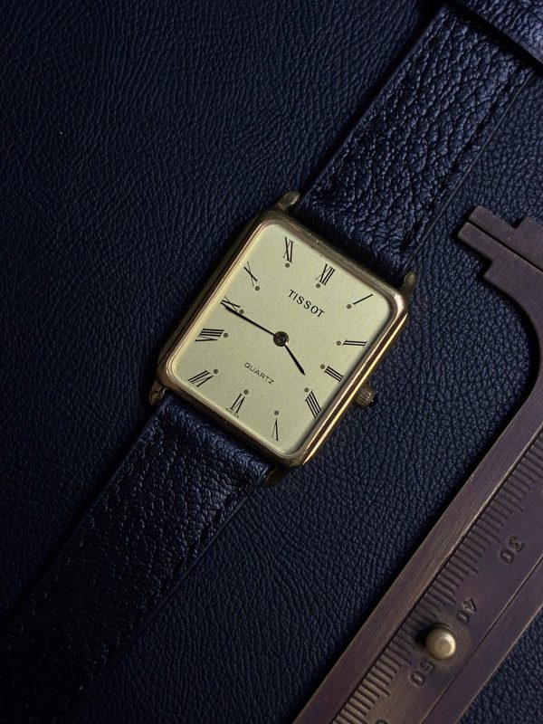 TISSOT TANK GOLD ROMAN DIAL